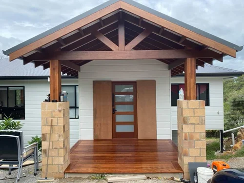 Freshly painted home with timber deck entry on the Gold Coast